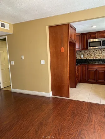 a view of kitchen with wooden floor