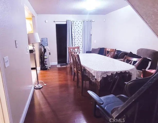 a living room with furniture a rug and a chandelier