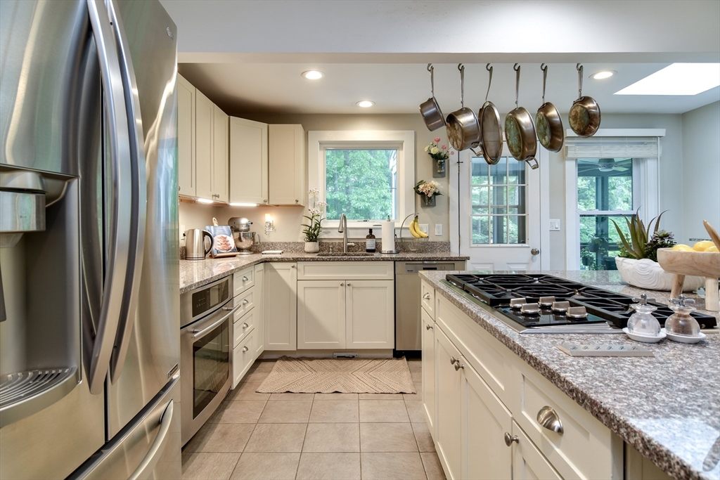 76 Pleasant Street South Natick, MA 01760 - Photo 12 of 36 a kitchen with a sink window and cabinets