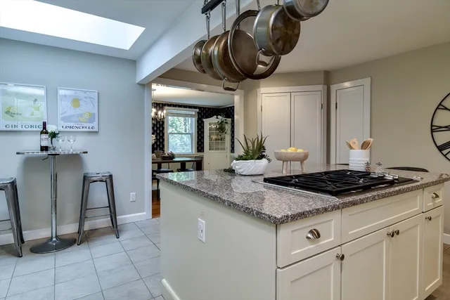 a kitchen with stainless steel appliances granite countertop a sink and a stove