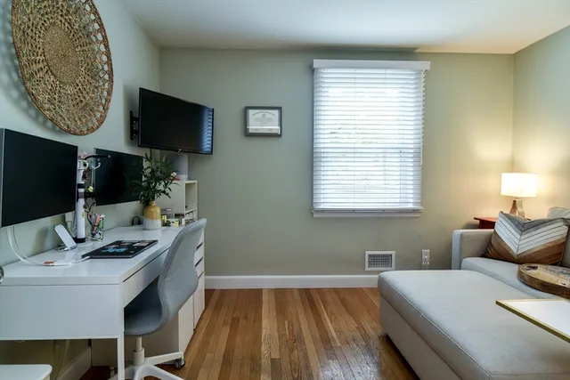 a room with a bed and a flat screen tv