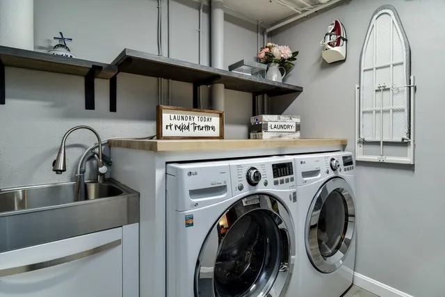 a view of storage and utility room with washer and dryer