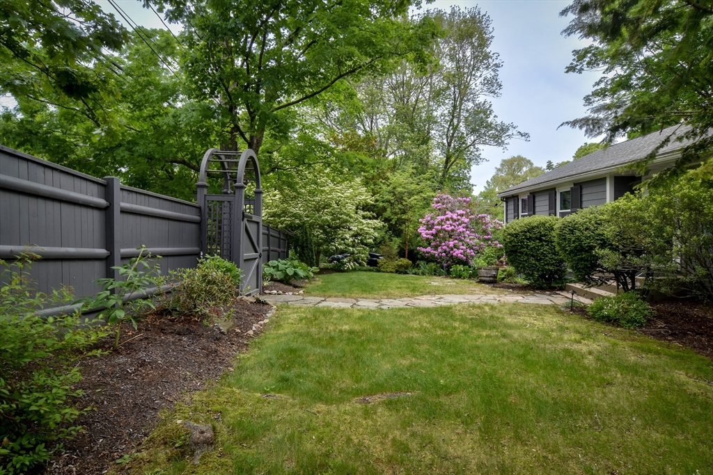 76 Pleasant Street South Natick, MA 01760 - Photo 28 of 36 a front view of a house with garden
