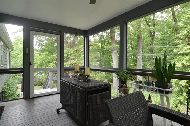 a room with furniture and large windows