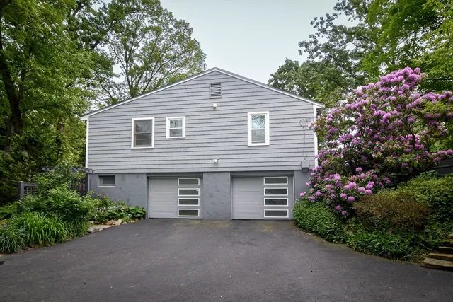 a front view of a house with a garage
