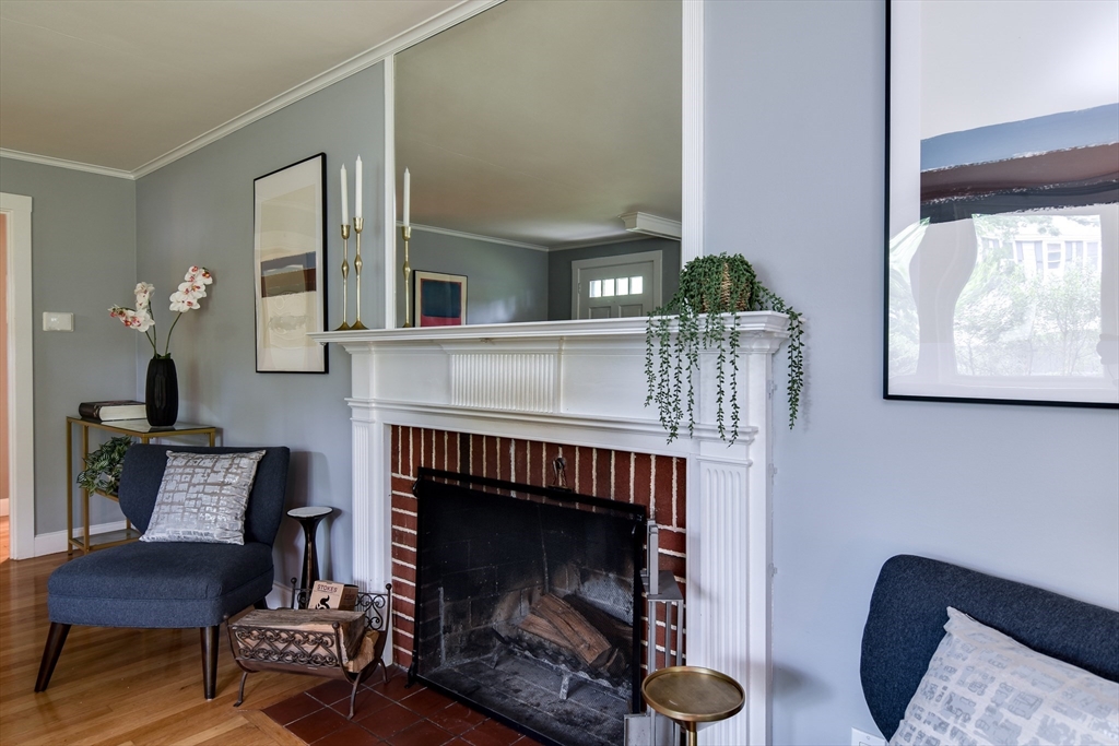 76 Pleasant Street South Natick, MA 01760 - Photo 5 of 36 a living room with furniture and a fireplace