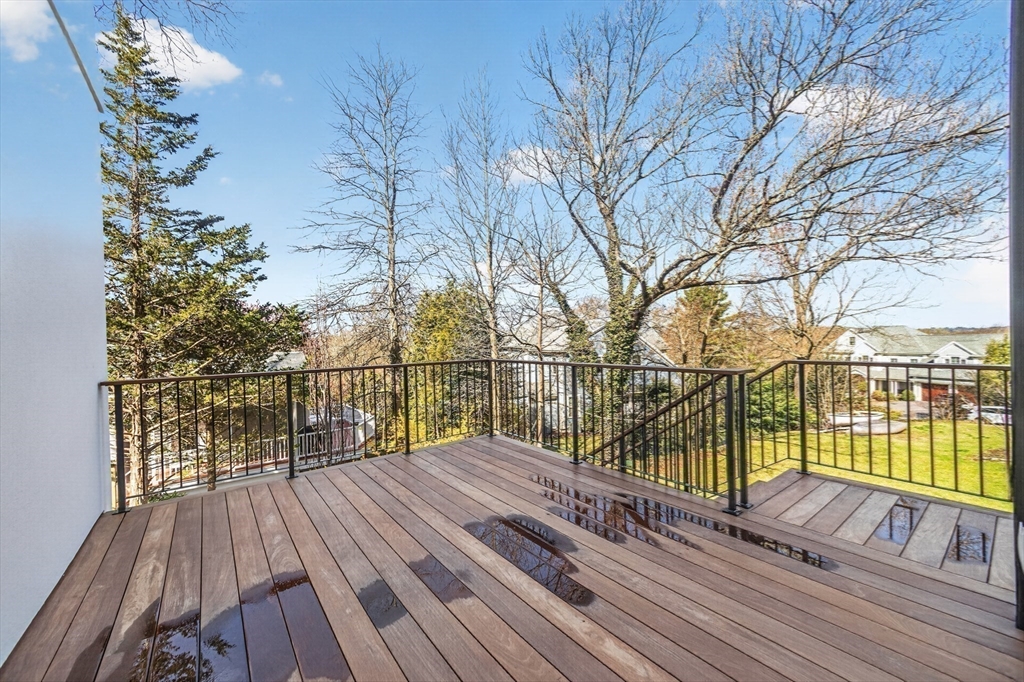 15 Bird Hill Road Lexington, MA 02421 - Photo 32 of 34 a view of balcony with wooden floor and fence