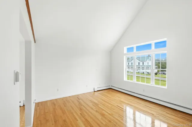 a view of an empty room and a window