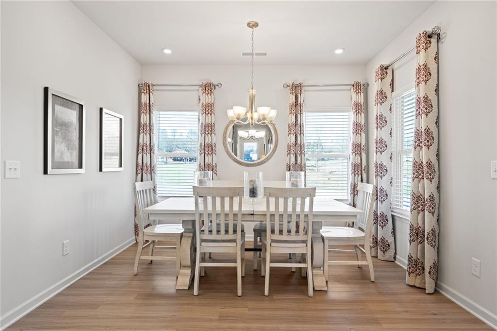 23 Willow Circle Rock Spring, GA 30739 - Photo 15 of 33 a view of a dining room with furniture window and wooden floor