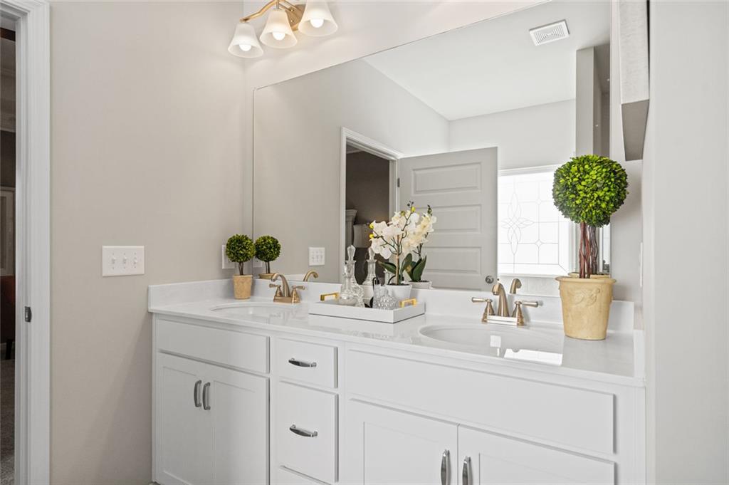 23 Willow Circle Rock Spring, GA 30739 - Photo 30 of 33 a bathroom with a sink and a mirror
