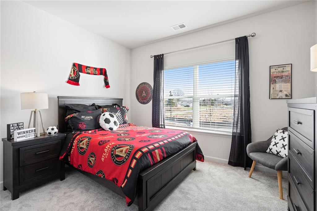 23 Willow Circle Rock Spring, GA 30739 - Photo 4 of 33 a bedroom with a bed and a window