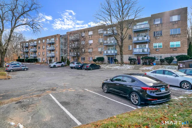 a car parked in front of a brick building