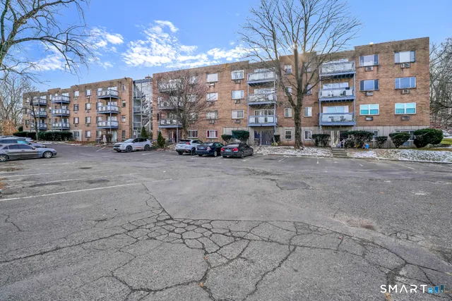 a view of a building with large trees