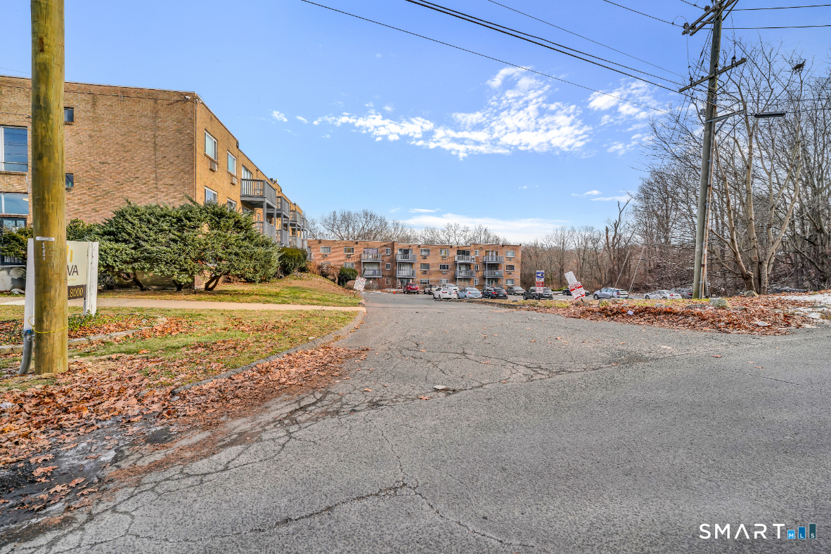 279 Oakville Avenue, Unit B12 Waterbury, CT 06708 - Photo 8 of 8 a view of a building with a road