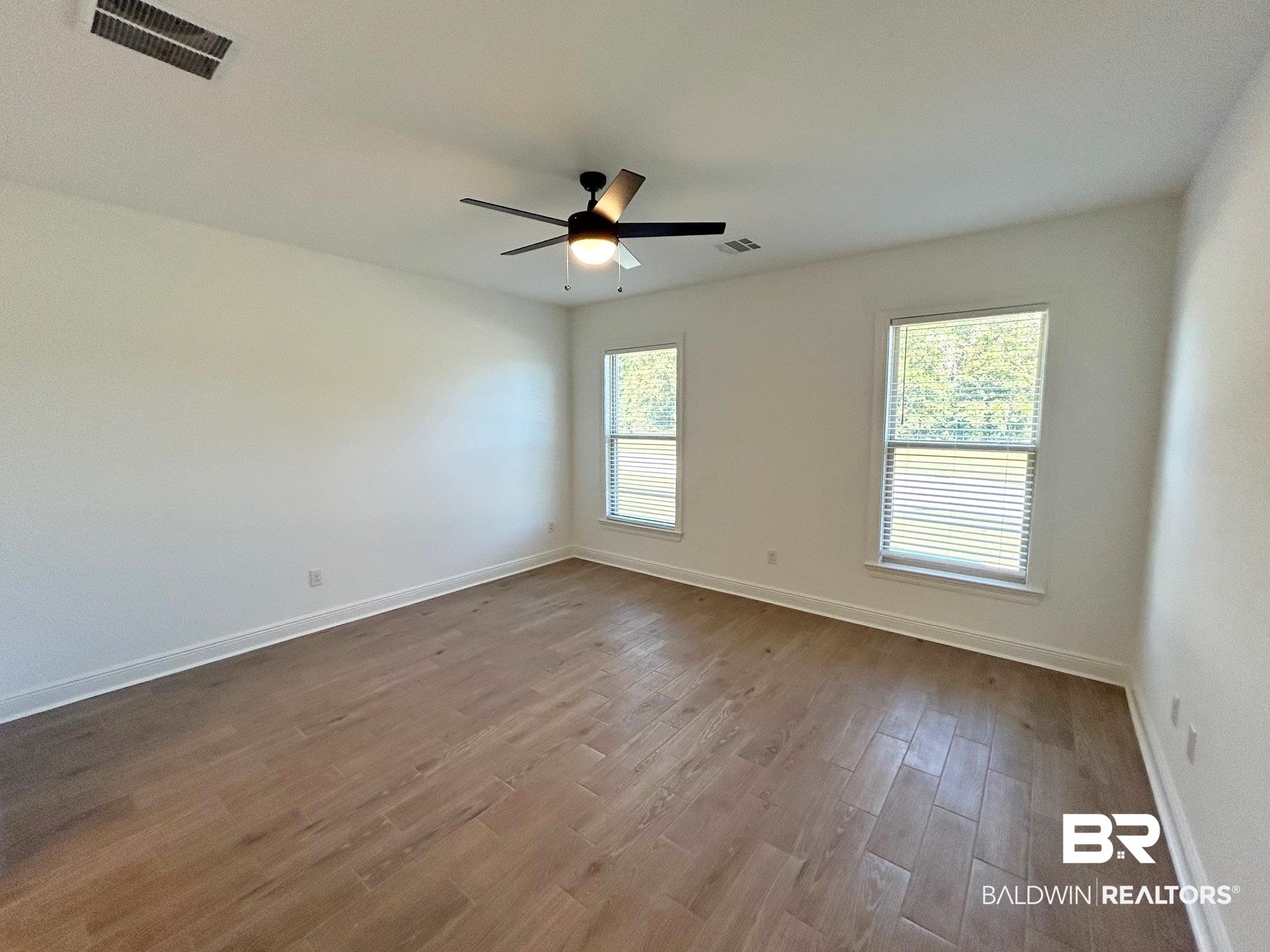 812 Sumter Loop Foley, AL 36535 - Photo 5 of 17 Empty room featuring ceiling fan and light hardwood / wood-style floors