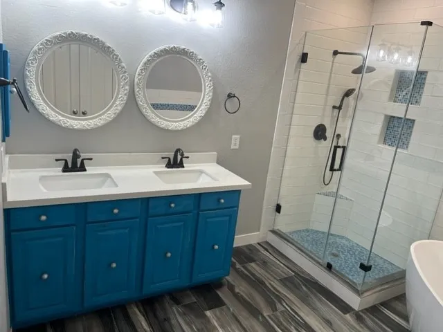 a bathroom with a double vanity sink and a mirror