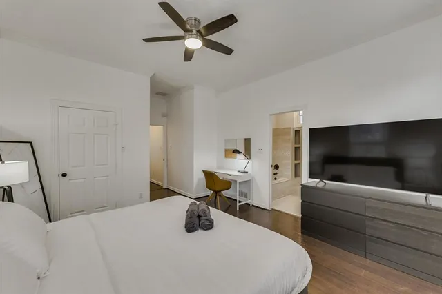 a bedroom with a bed and furniture