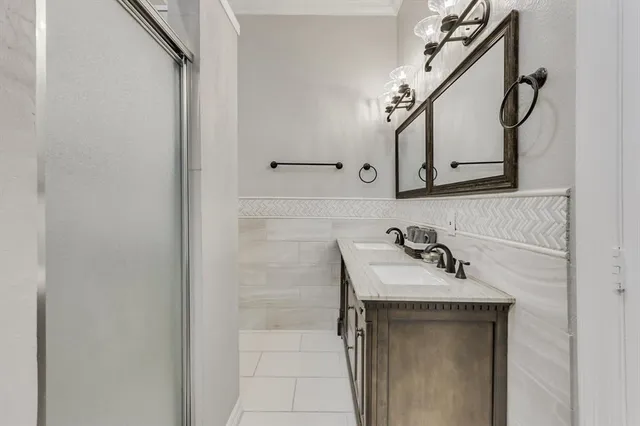 a bathroom with a sink and mirror