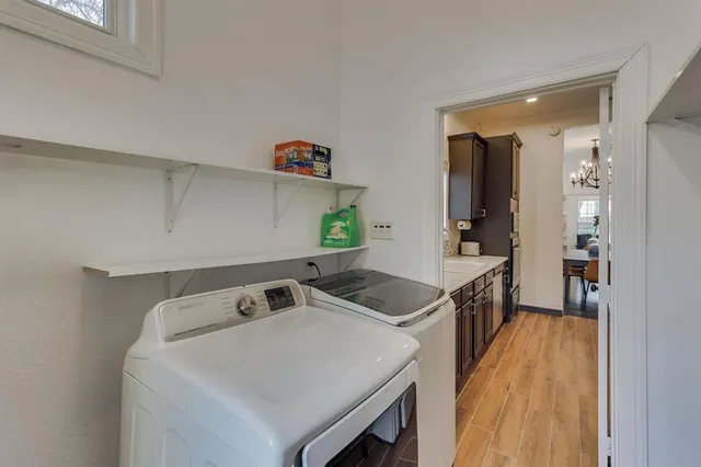 a kitchen that has a sink and a stove in it