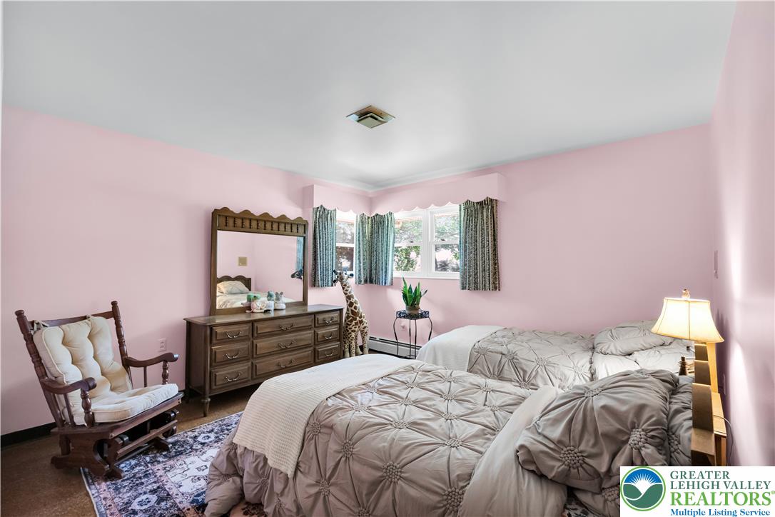 5747 Kernsville Road Orefield, PA 18069 - Photo 30 of 56 a bedroom with two beds and a chair