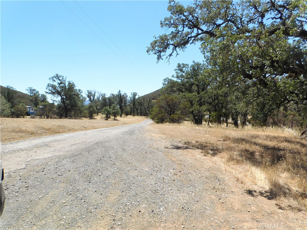 997 Watertrough Road Clearlake Oaks, CA 95423 - Photo 18 of 20 a view of dirt yard with a mountain