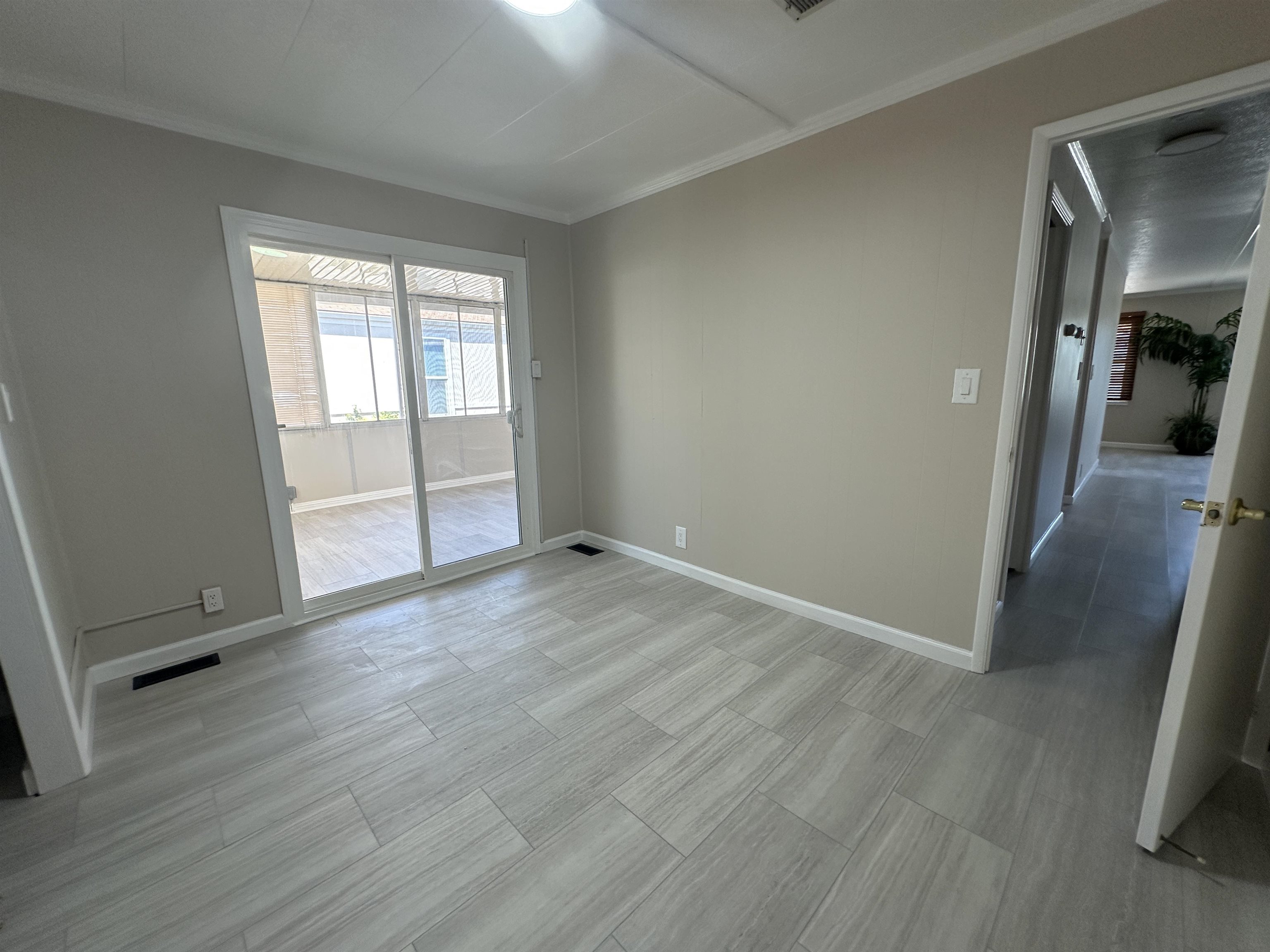 711 Old Canyon Road, Unit 56 Fremont, CA 94536 - Photo 27 of 42 an empty room with wooden floor and windows