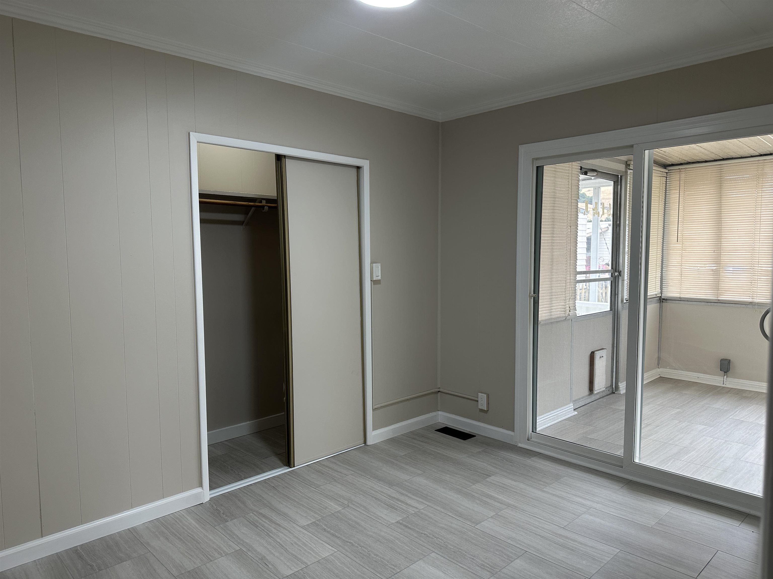 711 Old Canyon Road, Unit 56 Fremont, CA 94536 - Photo 28 of 42 an empty room with wooden floor and a window