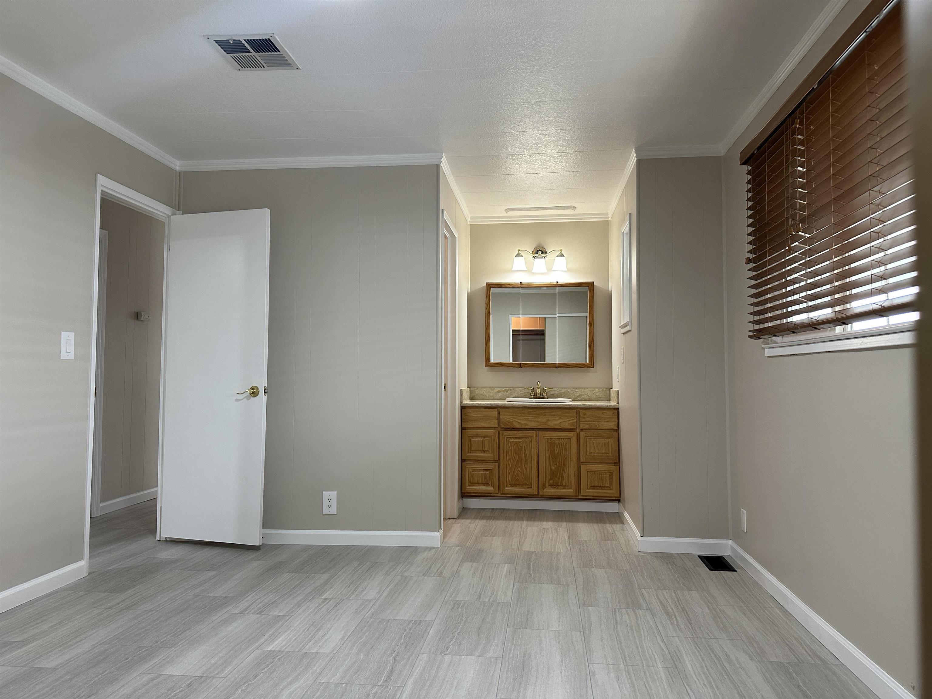 711 Old Canyon Road, Unit 56 Fremont, CA 94536 - Photo 31 of 42 a view of hallway with sink and wooden floor