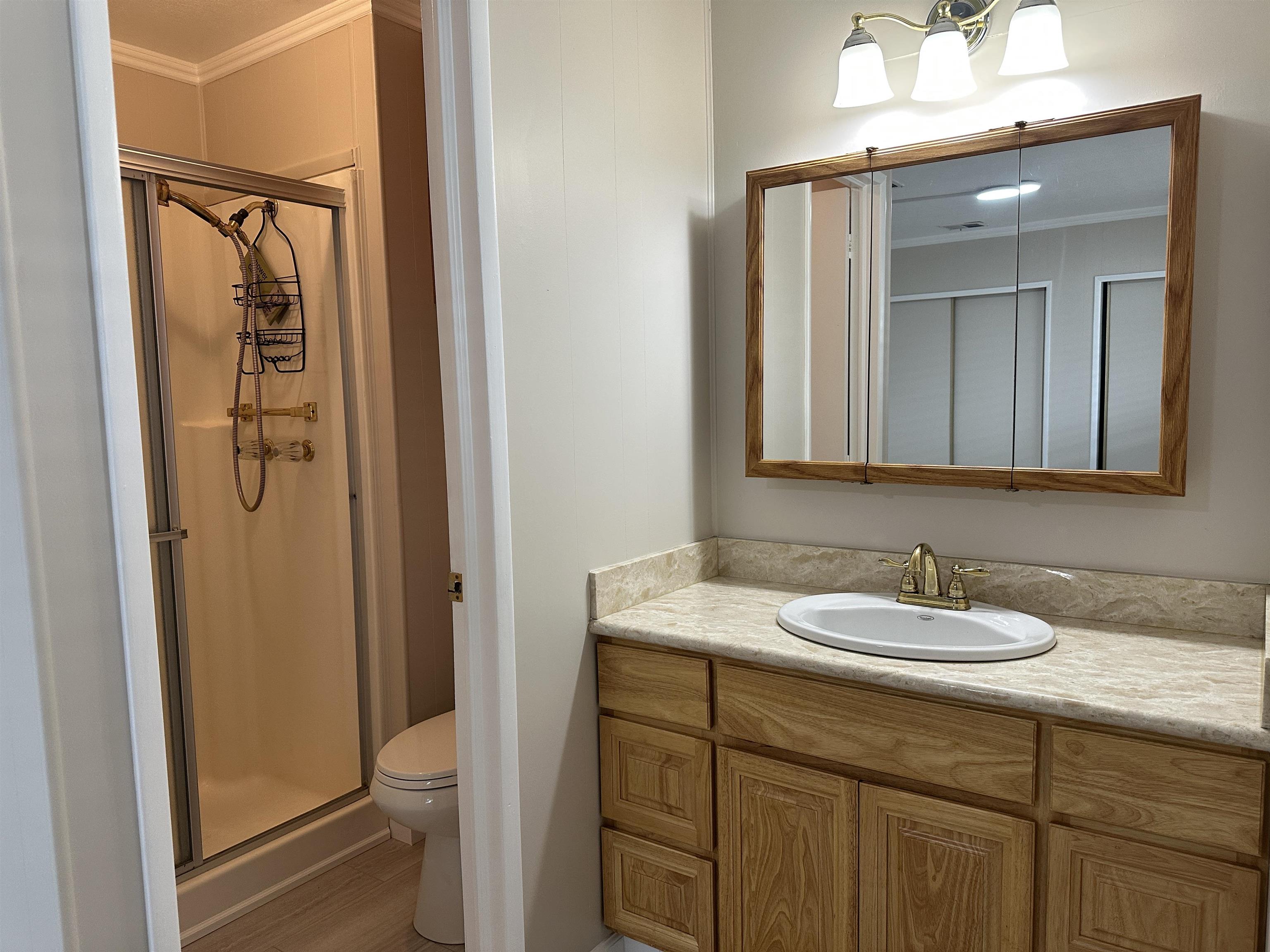 711 Old Canyon Road, Unit 56 Fremont, CA 94536 - Photo 33 of 42 a bathroom with a sink a toilet and shower