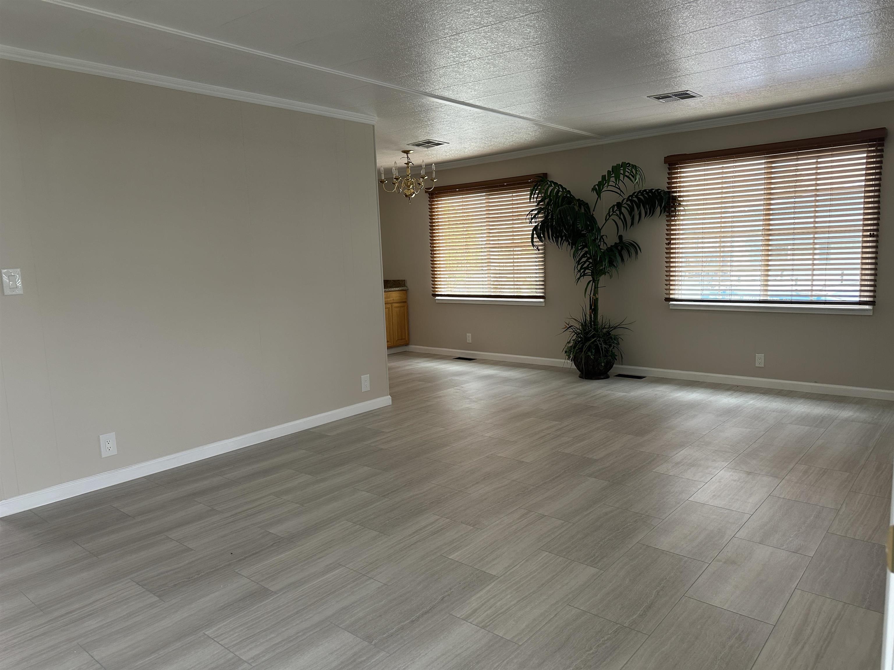 711 Old Canyon Road, Unit 56 Fremont, CA 94536 - Photo 5 of 42 a view of empty room with wooden floor and fan