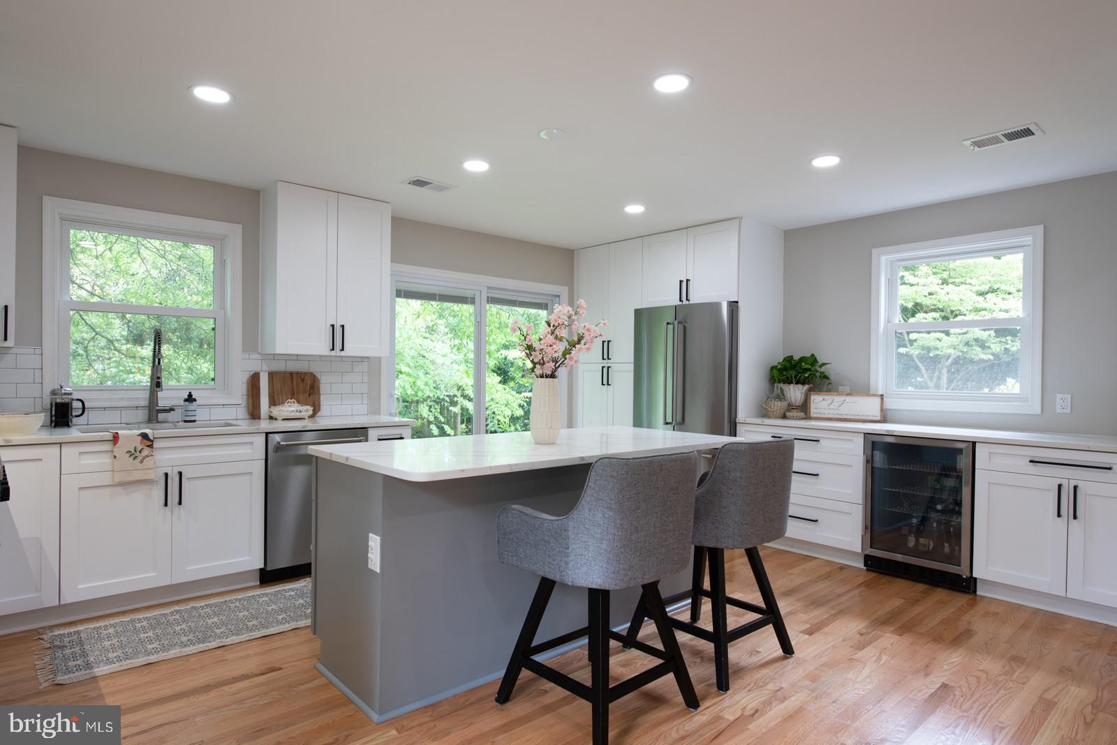 7923 New Market Road Alexandria, VA 22308 - Photo 14 of 42 Granite, stainless, custom cabinetry, wine cooler