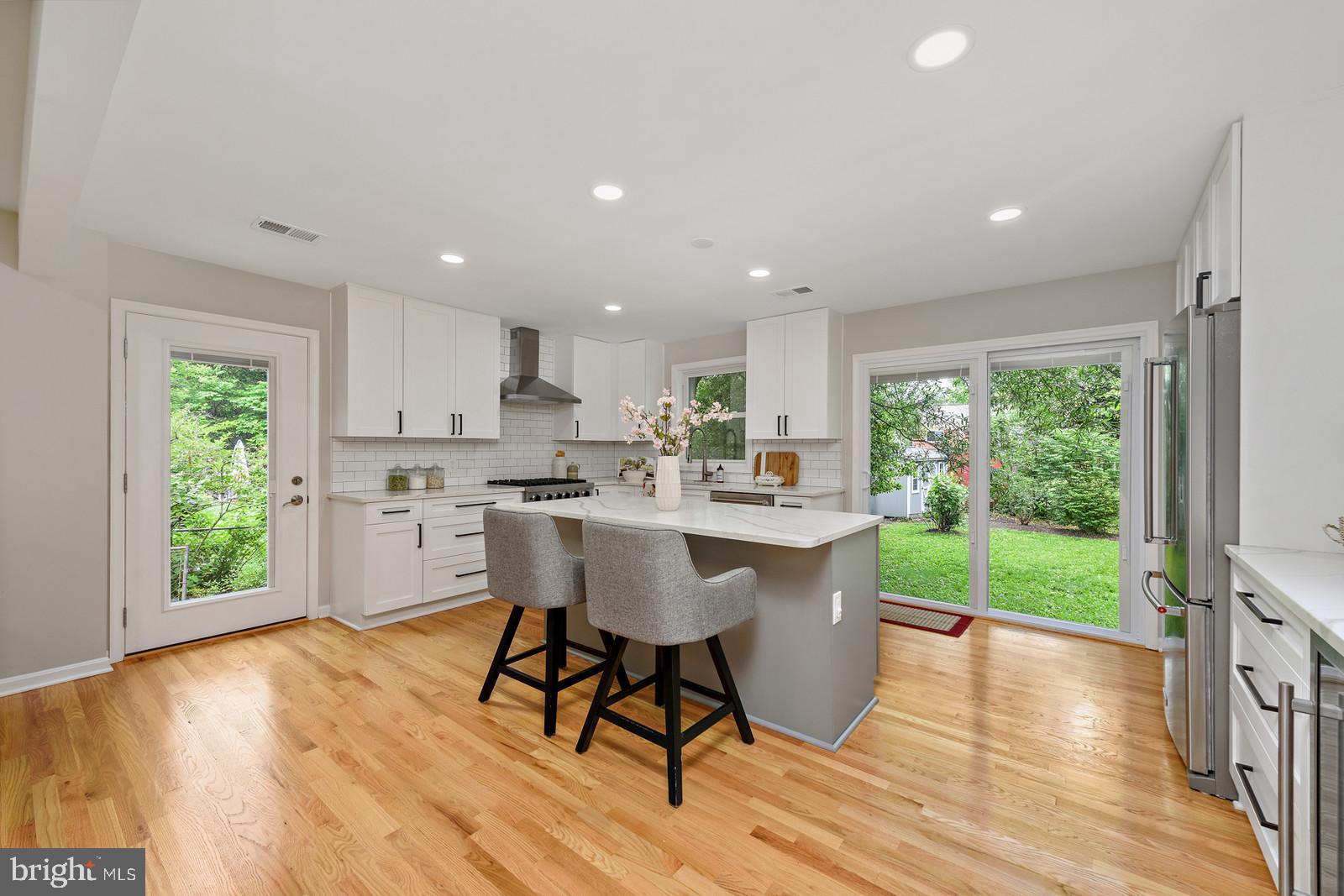 7923 New Market Road Alexandria, VA 22308 - Photo 19 of 42 Slider from kitchen to back yard