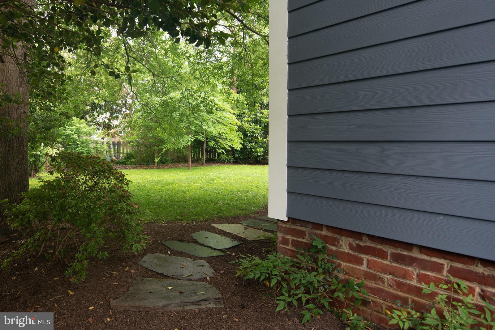 7923 New Market Road Alexandria, VA 22308 - Photo 35 of 42 Custom pavers from side yard to back
