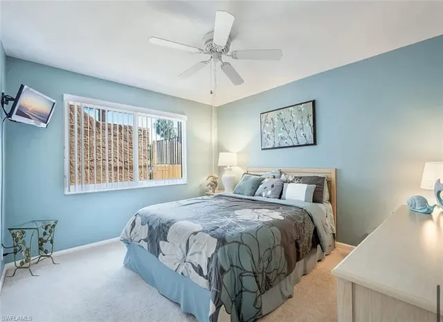 a bedroom with a bed and a table