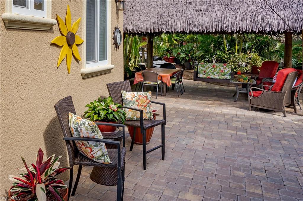 13446 Ladyfish Lane Naples, FL 34114 - Photo 19 of 44 a view of an outdoor sitting area with furniture