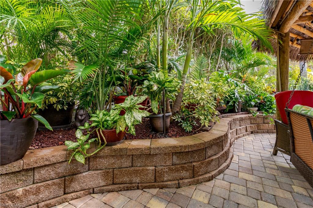 13446 Ladyfish Lane Naples, FL 34114 - Photo 2 of 44 a view of a backyard with sitting area