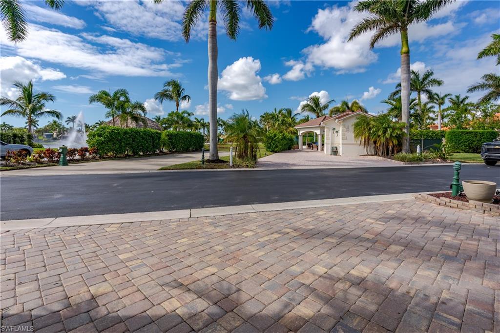 13446 Ladyfish Lane Naples, FL 34114 - Photo 30 of 44 a backyard of a house with lots of green space