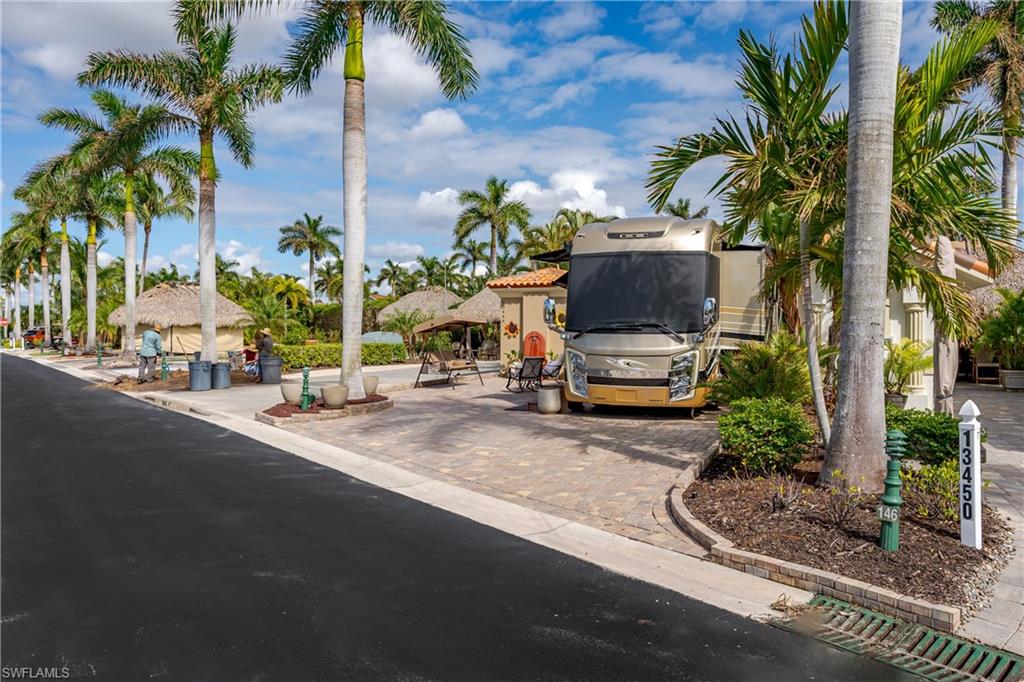 13446 Ladyfish Lane Naples, FL 34114 - Photo 32 of 44 a car parked on the side of the road