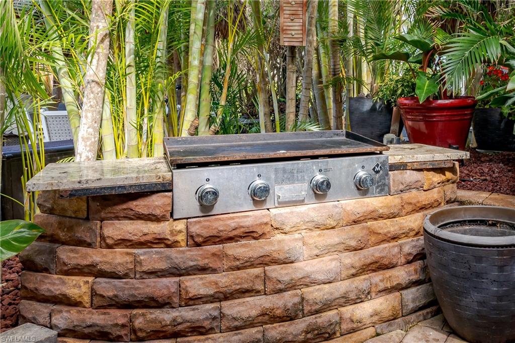 13446 Ladyfish Lane Naples, FL 34114 - Photo 5 of 44 a room with table and chairs