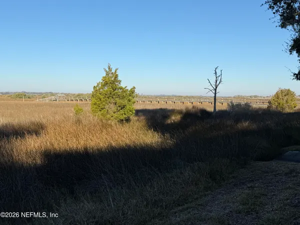 a view of lake with green space