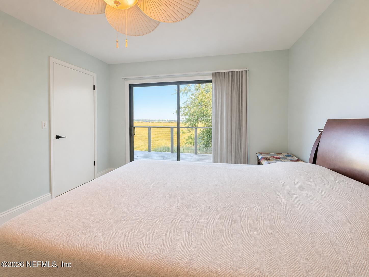 131 Rio Del Mar Street, Unit C St. Augustine, FL 32080 - Photo 11 of 14 a bedroom with a bed and a window