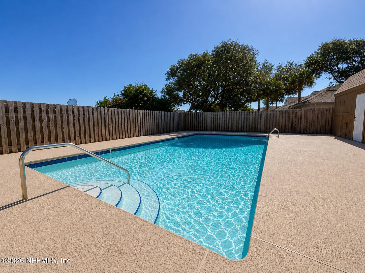 131 Rio Del Mar Street, Unit C St. Augustine, FL 32080 - Photo 12 of 14 a view of a backyard with wooden fence