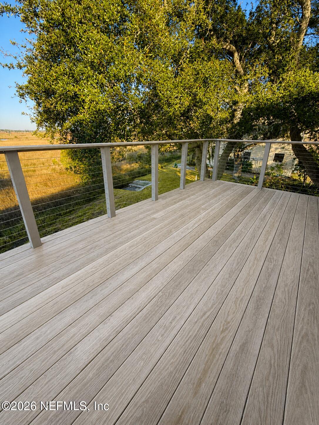 131 Rio Del Mar Street, Unit C St. Augustine, FL 32080 - Photo 13 of 14 a view of balcony with wooden floor and bench