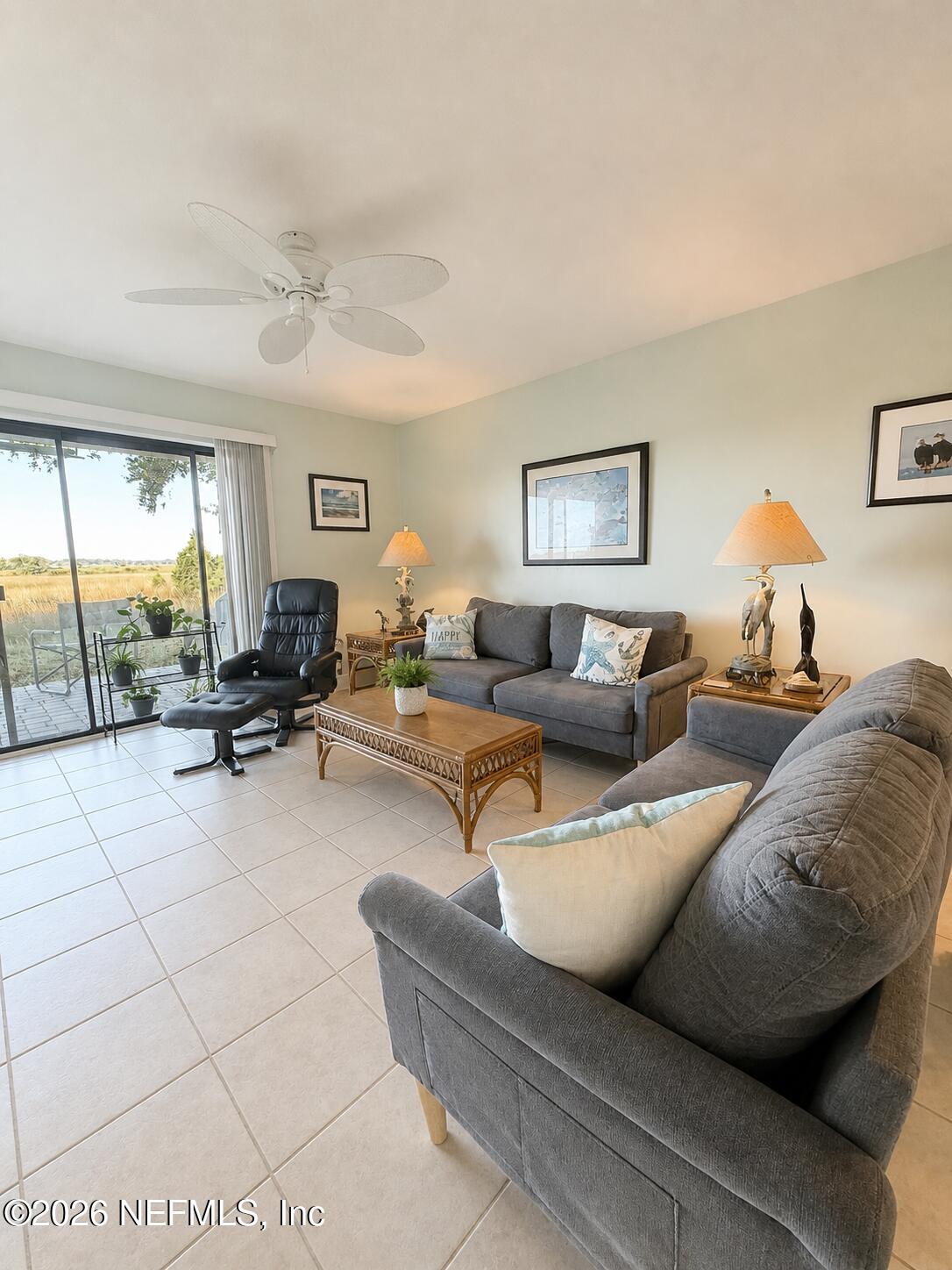 131 Rio Del Mar Street, Unit C St. Augustine, FL 32080 - Photo 6 of 14 a living room with furniture and a large window