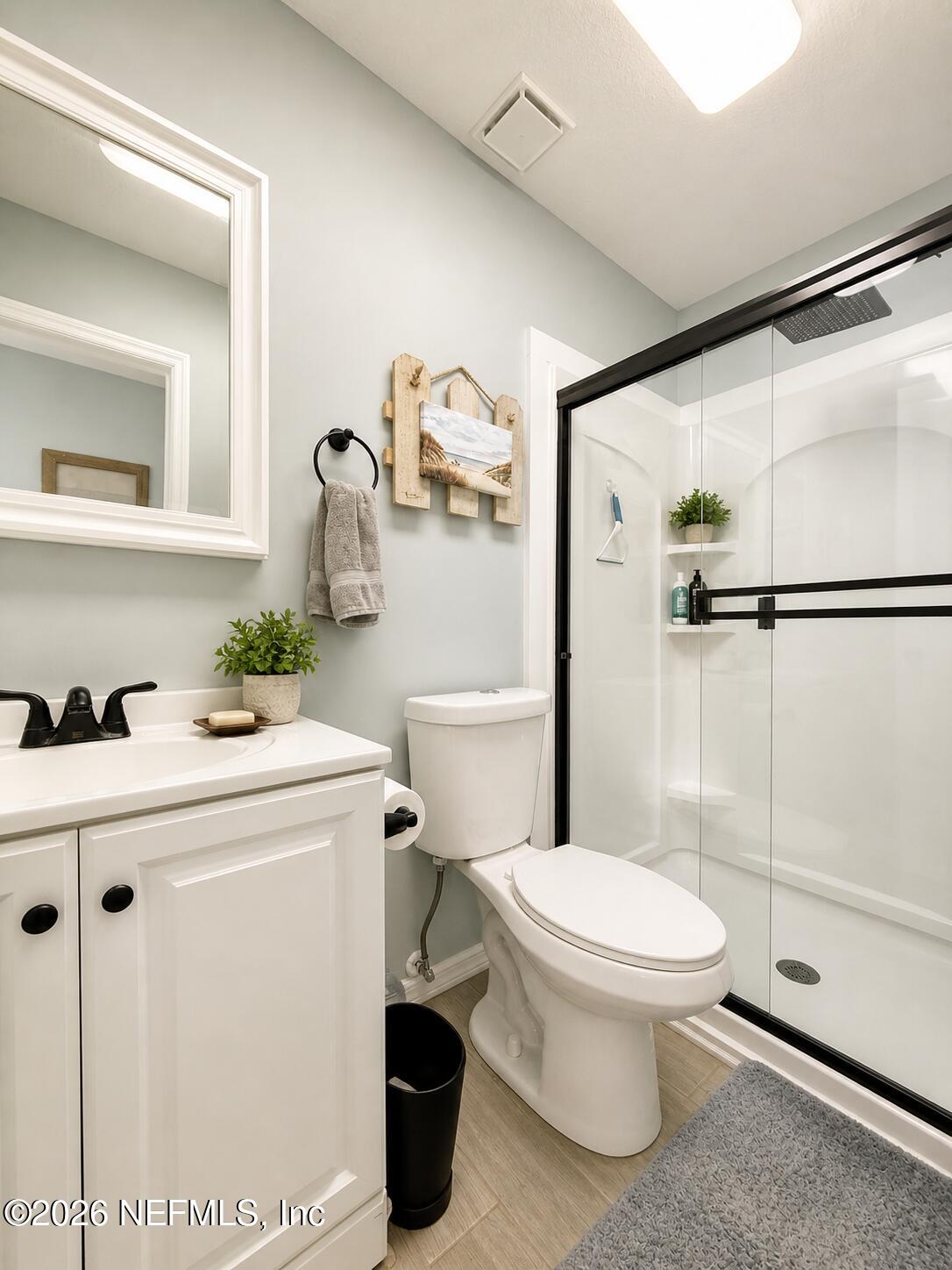131 Rio Del Mar Street, Unit C St. Augustine, FL 32080 - Photo 7 of 14 a bathroom with a sink a toilet and a shower