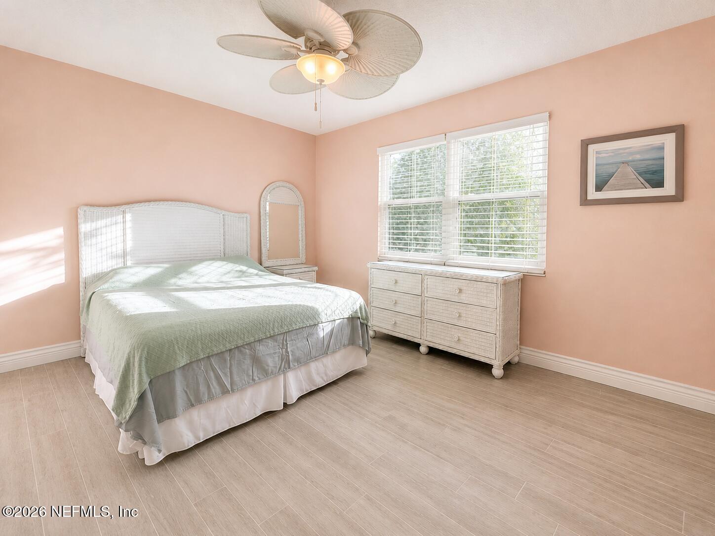 131 Rio Del Mar Street, Unit C St. Augustine, FL 32080 - Photo 8 of 14 a bedroom with a bed a dresser and a window