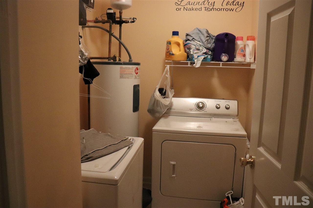 8620 Neuse Landing Lane, Unit 110 Raleigh, NC 27616 - Photo 4 of 6 a utility room with dryer and washer