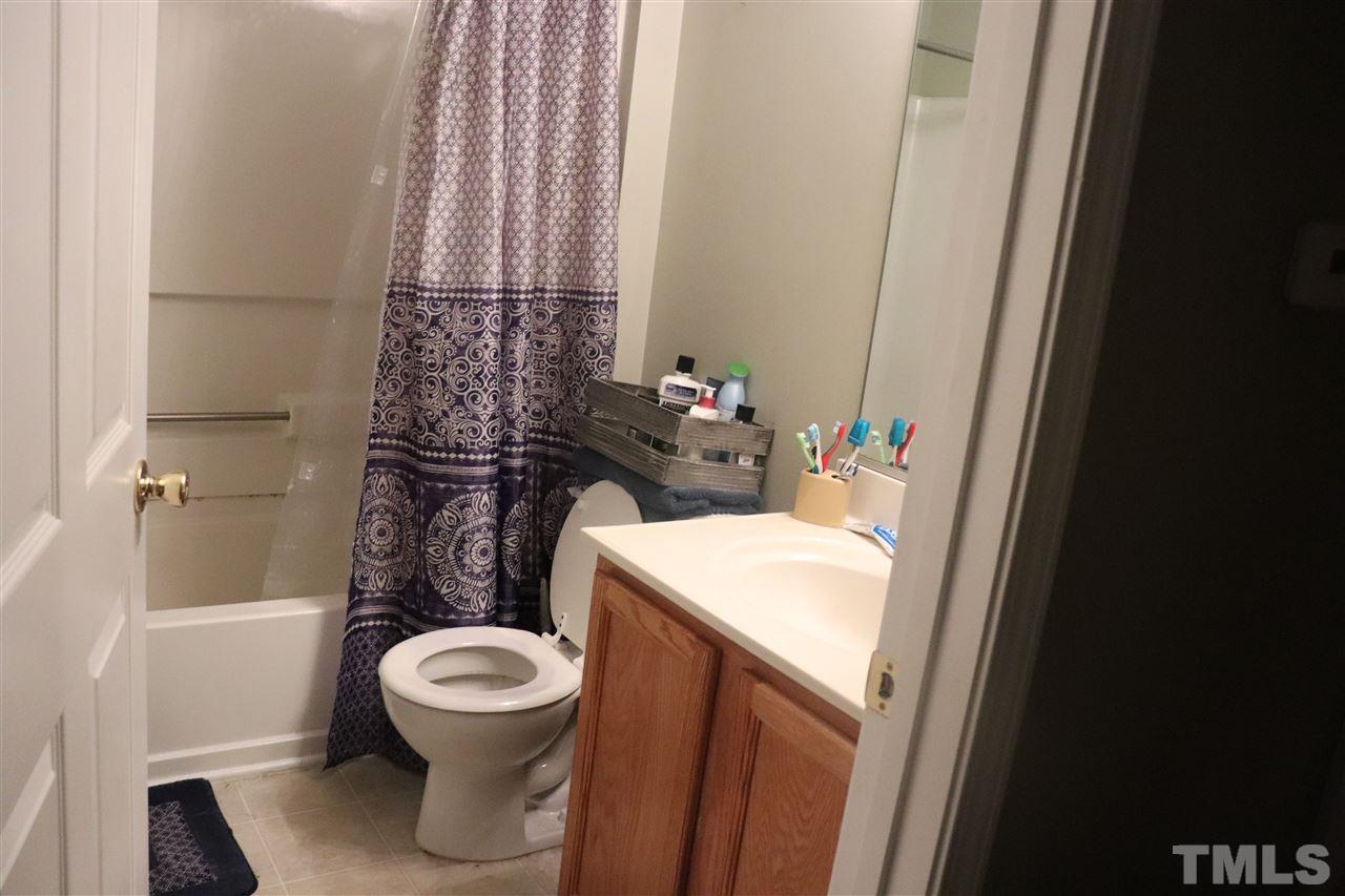 8620 Neuse Landing Lane, Unit 110 Raleigh, NC 27616 - Photo 6 of 6 a bathroom with a sink and a toilet