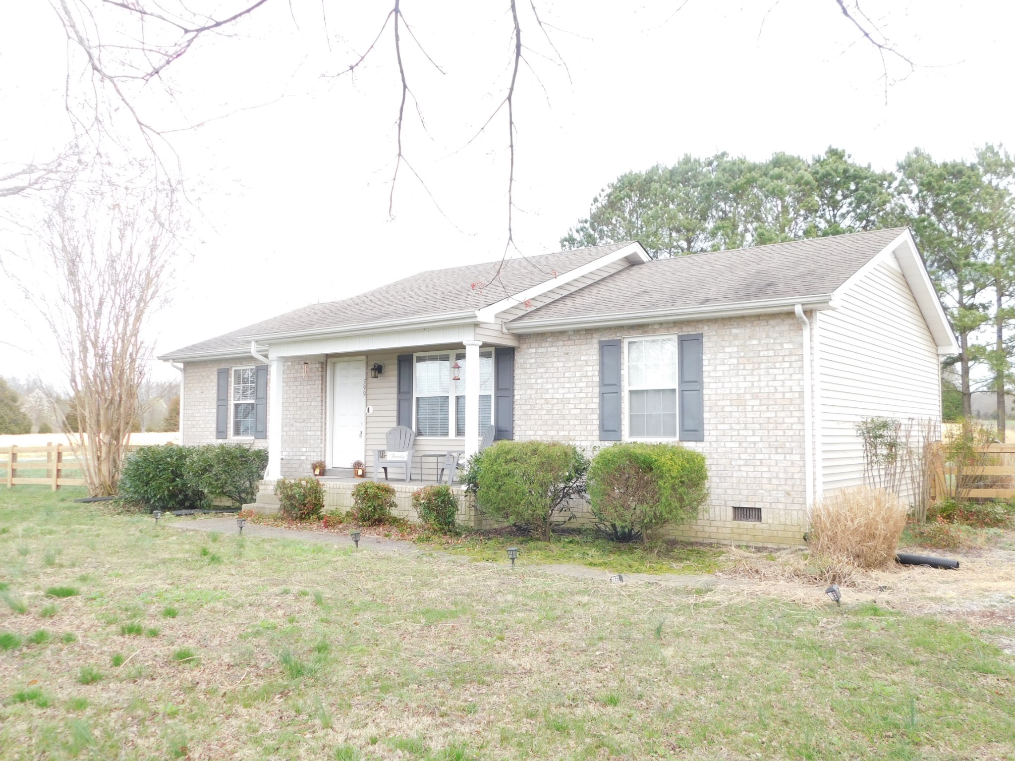 599 Jackson Road Portland, TN 37148 - Photo 1 of 39 a front view of a house with garden