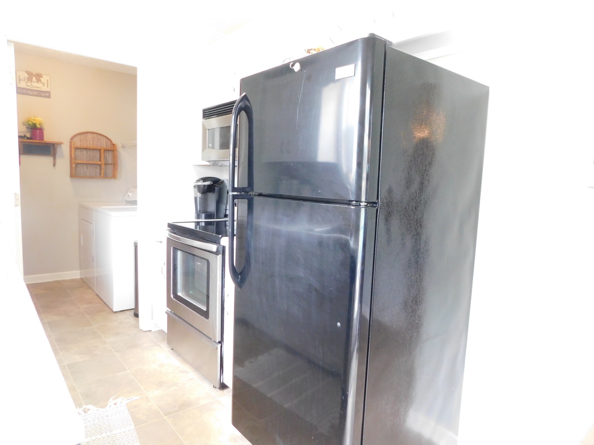 599 Jackson Road Portland, TN 37148 - Photo 13 of 39 a metallic refrigerator freezer sitting in a kitchen